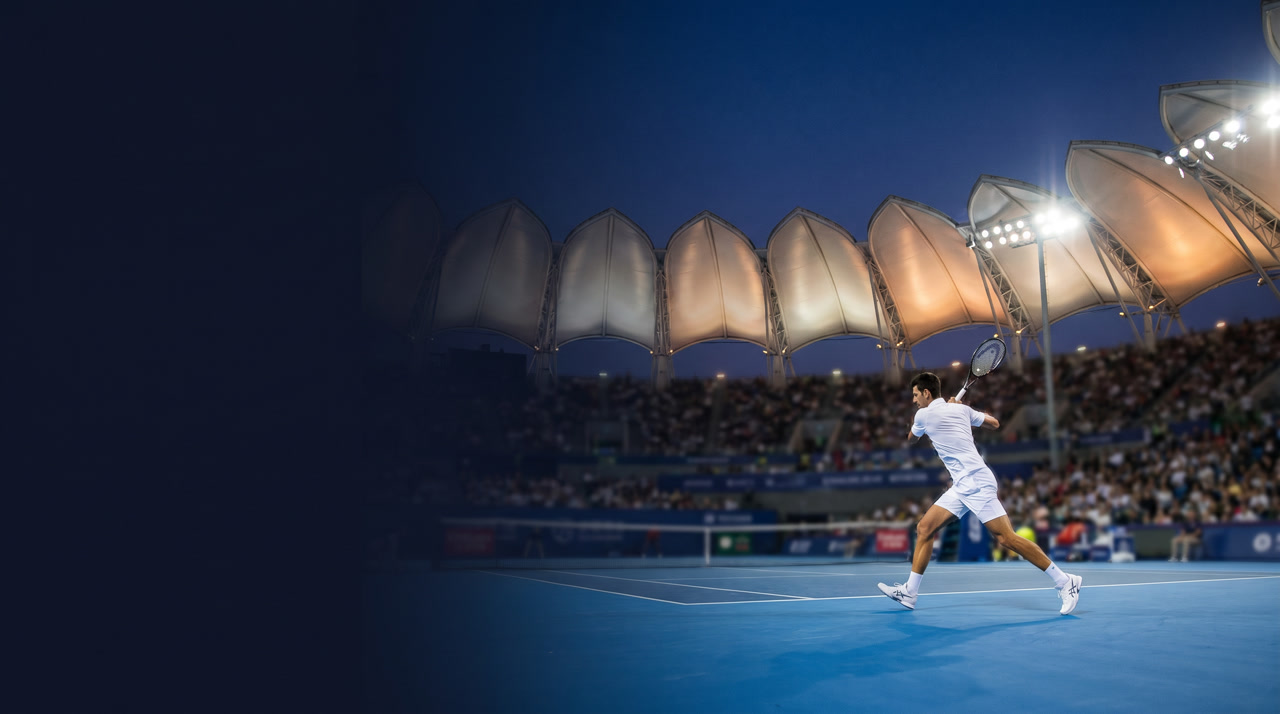Qizhong Forest Sports City Arena at the Shanghai Masters during an evening session, the iconic magnolia-petal retractable roof open and segments framing the night sky, blue hard court bright under arena floodlights, deep navy and warm amber atmosphere